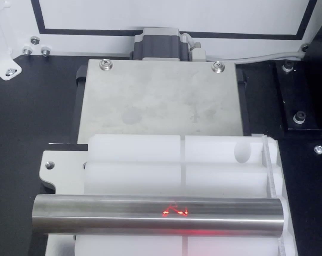 Laser etching a polished tungsten carbide component inside a marking machine